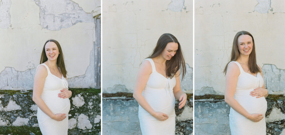 Three side-by-side pictures of a pregnant woman wearing a white dress during a maternity photo session on film. She is standing next to a neutral rock wall at Government House in Victoria BC