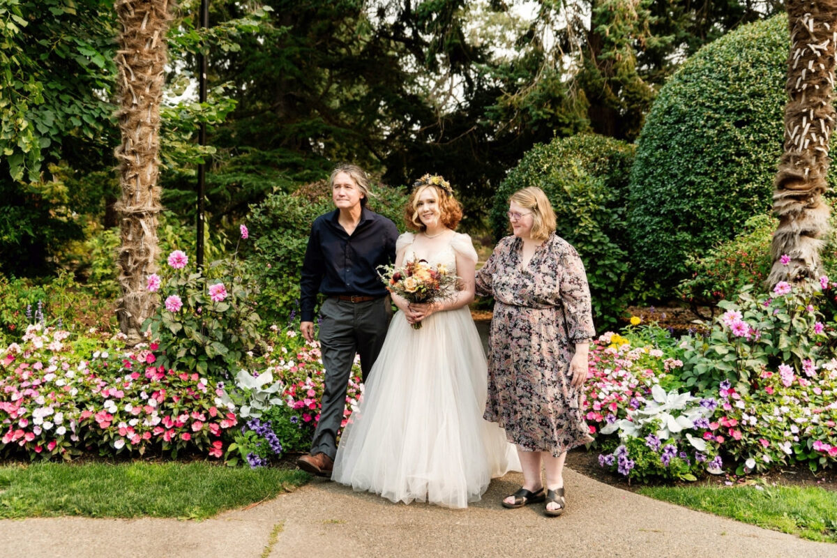 Bride walking up the aisle at her wedding at Beacon Hill Park