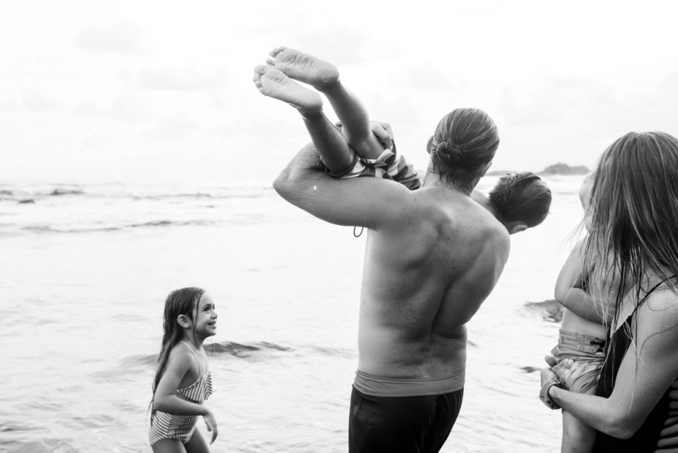 Family portraits at the beach candid documentary photographer