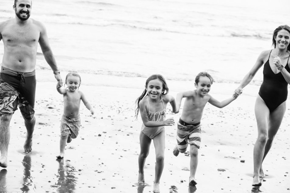 Family portraits at the beach candid documentary photographer