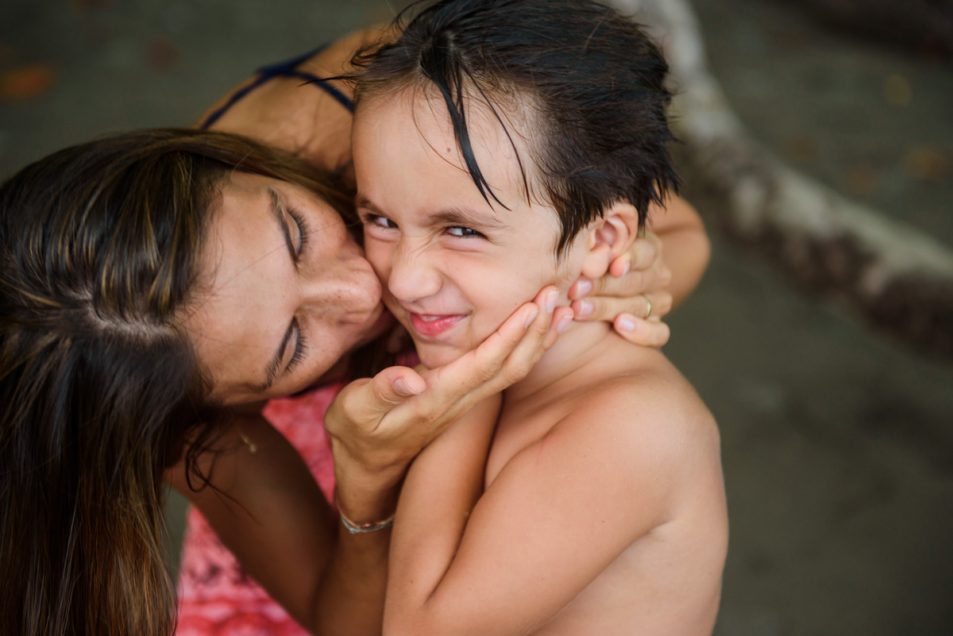 Family portraits at the beach candid documentary photographer