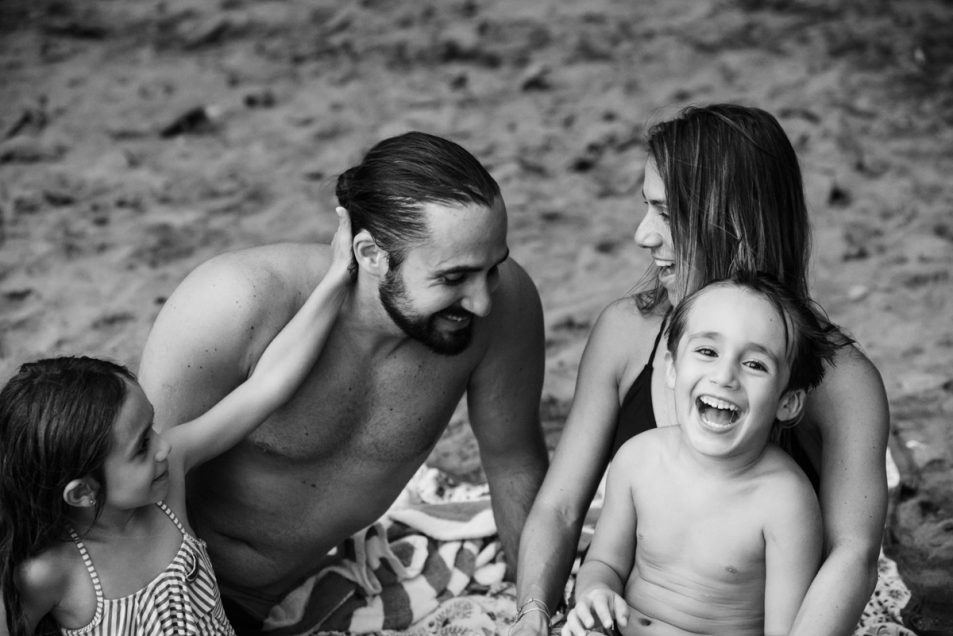 Family portraits at the beach candid documentary photographer