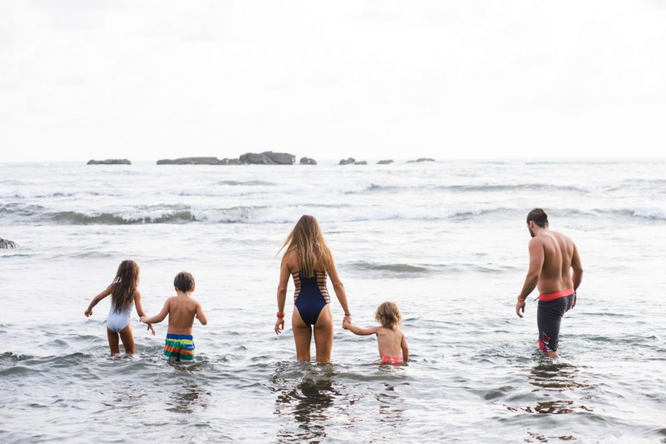 Family portraits at the beach candid documentary photographer