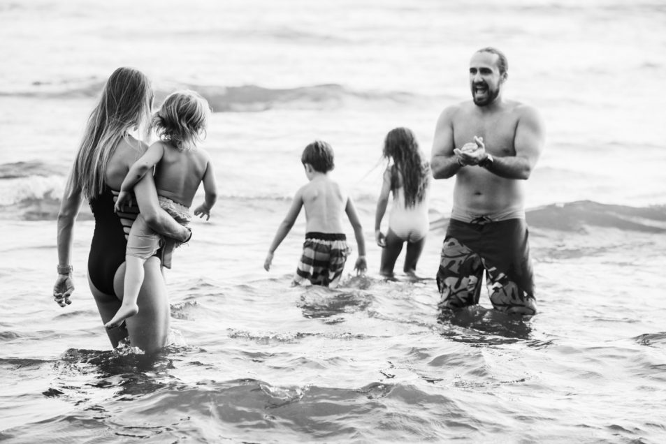 Family portraits at the beach candid documentary photographer