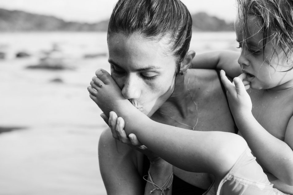 Family portraits at the beach candid documentary photographer