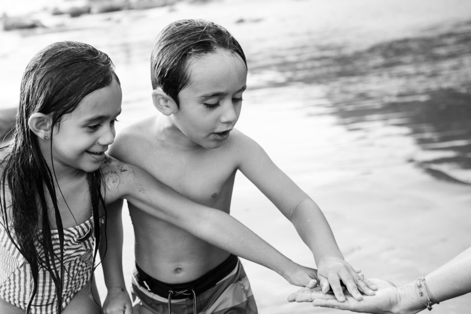 Family portraits at the beach candid documentary photographer