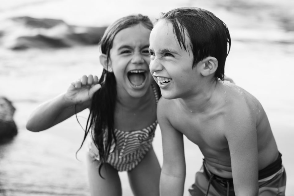 Family portraits at the beach candid documentary photographer