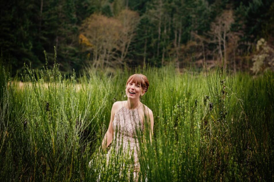 A bride in a pink wedding dress at East Sooke Park in Victoria BC