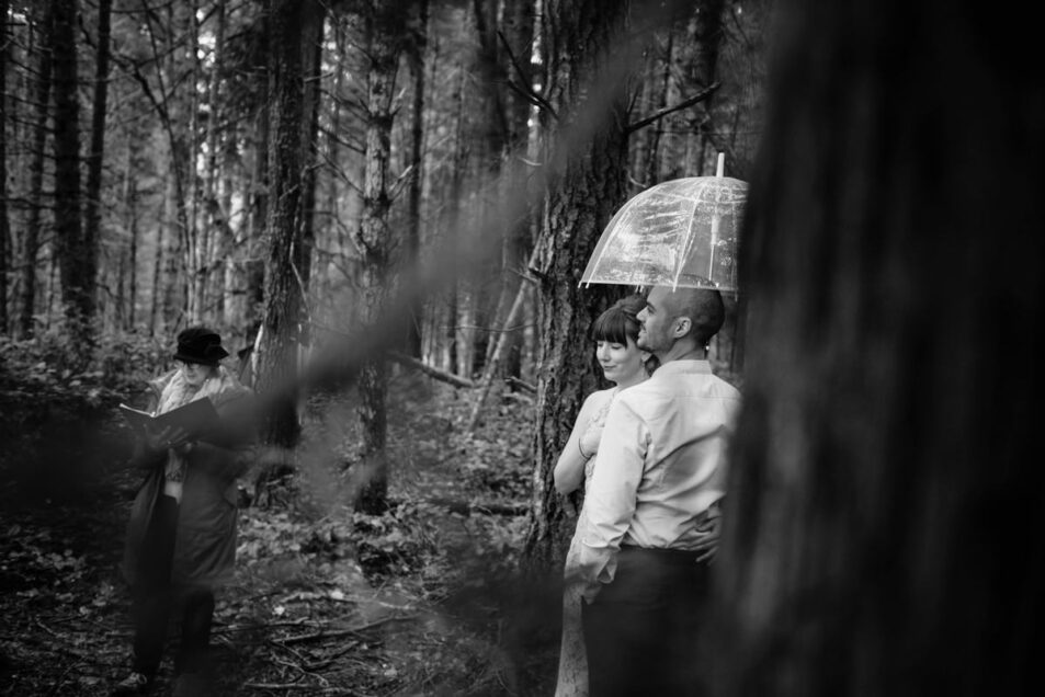 Rainy day wedding photography Victoria BC with clear umbrellas