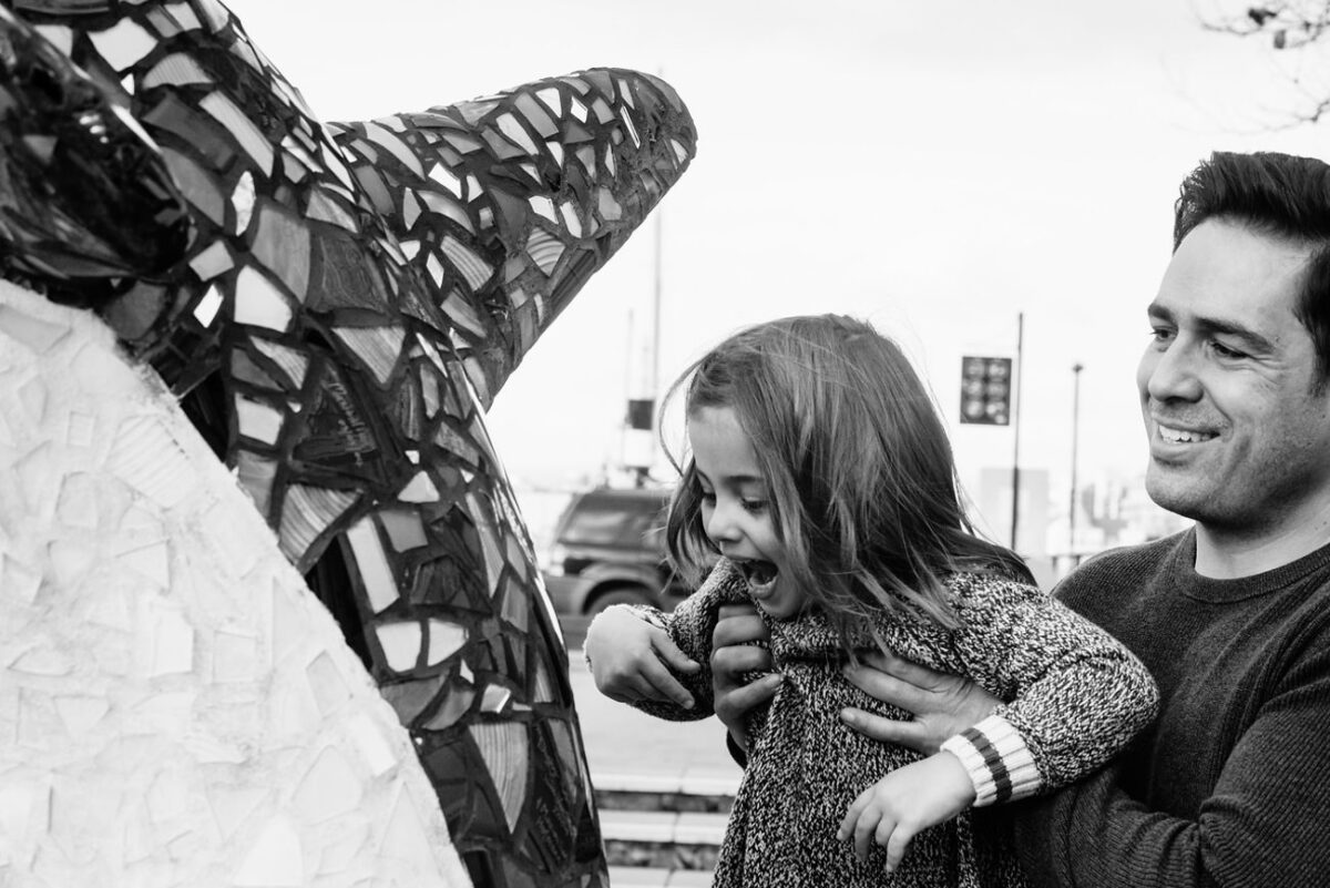 Natural and candid family portraits in Victoria BC at the inner harbour in the winter time.