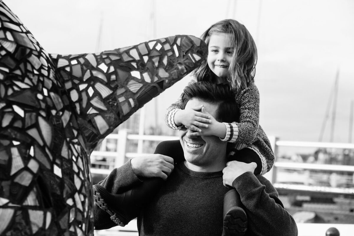 Victoria BC Family portrait mini-session with a five-year-old at the inner harbour near the Legislature buildings in Victoria, British Columbia