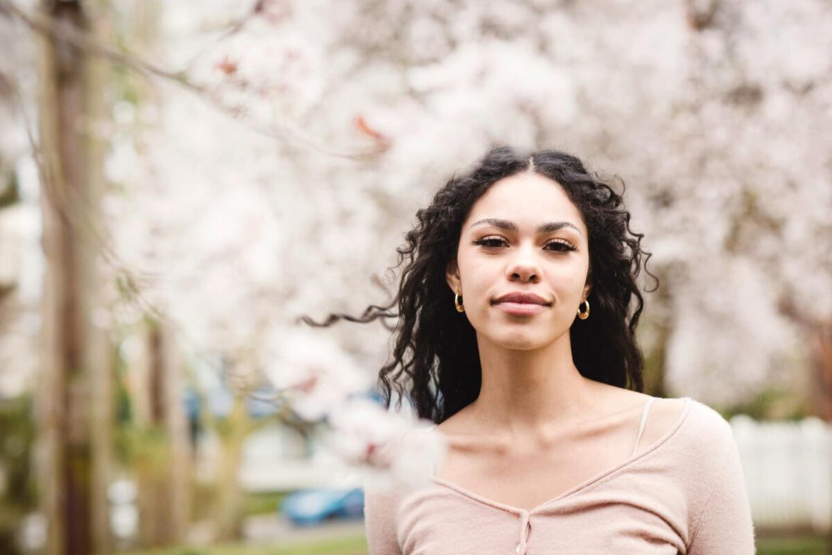 Fashion model portfolio shoot at Thunderbird Park in Victoria during cherry blossom season.