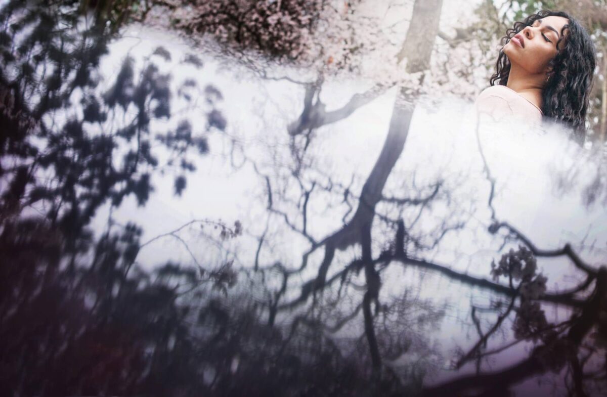 Reflection fashion photography with cherry blossoms in Victoria BC