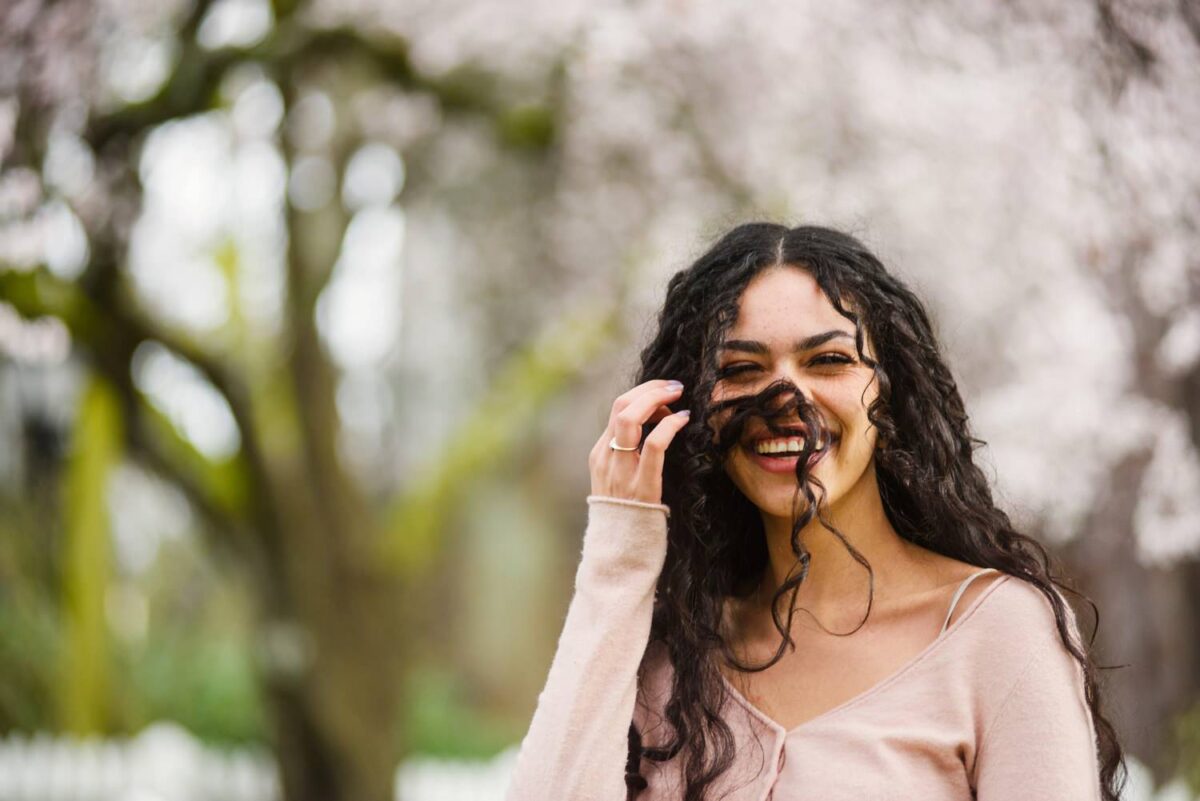 Fashion photography in Victoria BC during cherry blossom season. The location is Thunderbird Park beside the museum on Vancouver Island.