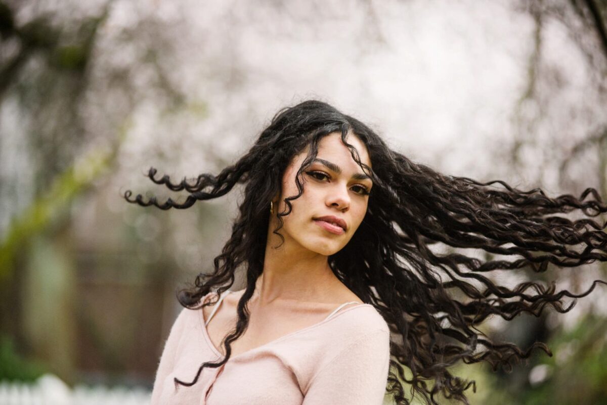 Fashion photography in Victoria BC during cherry blossom season. The location is Thunderbird Park beside the museum on Vancouver Island.