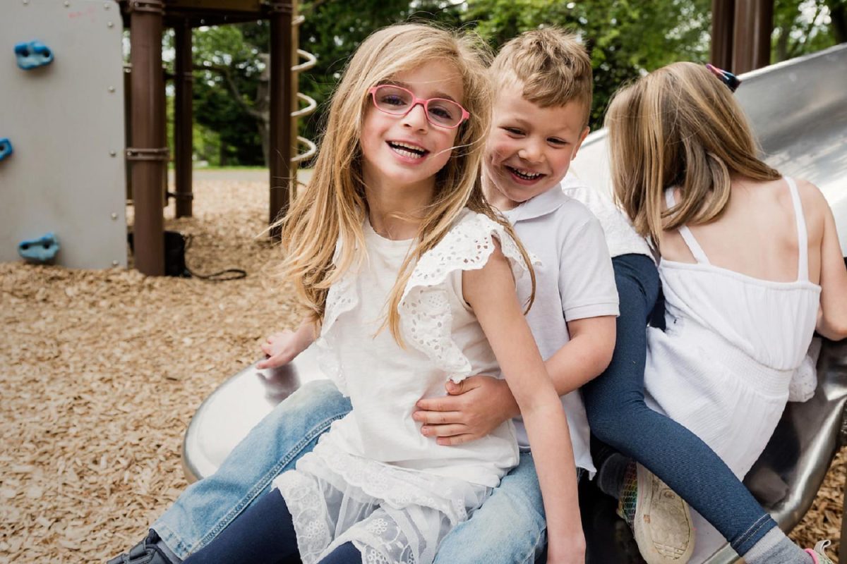 Portraits of a family playing at Beacon Hill Park