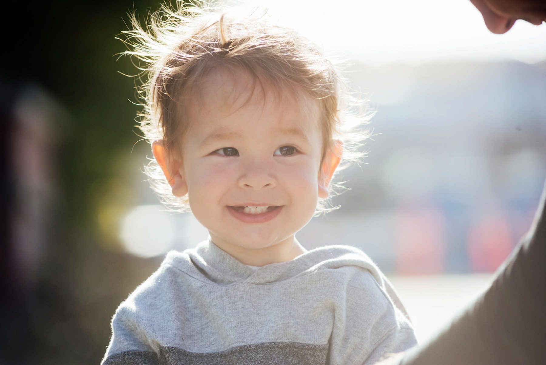 A candid portrait of a toddler in Victoria BC by photographer FunkyTown Photography