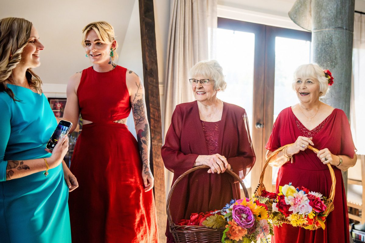 Grandmothers as flower girls wearing red dresses