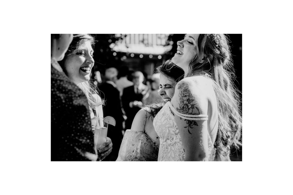 Bride being hugged and congratulated after the wedding