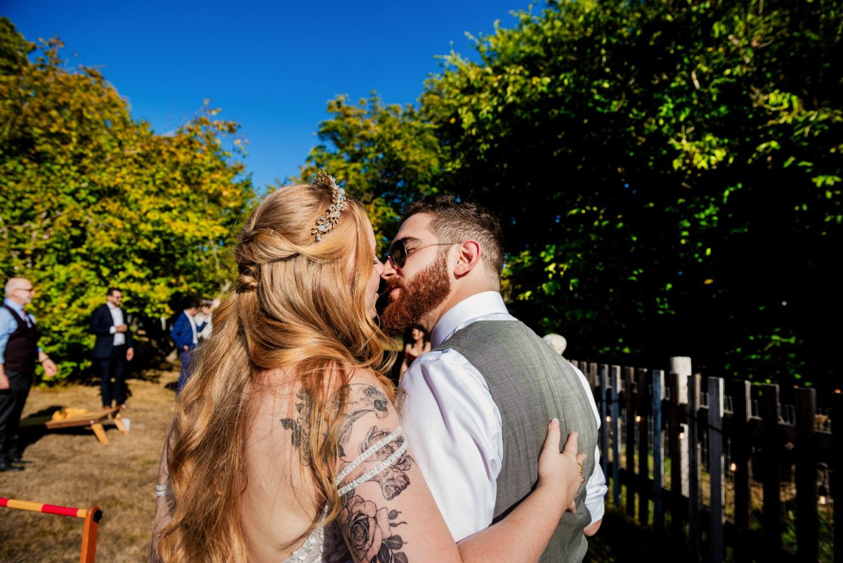 Candid photo of a bride and groom at their wedding reception