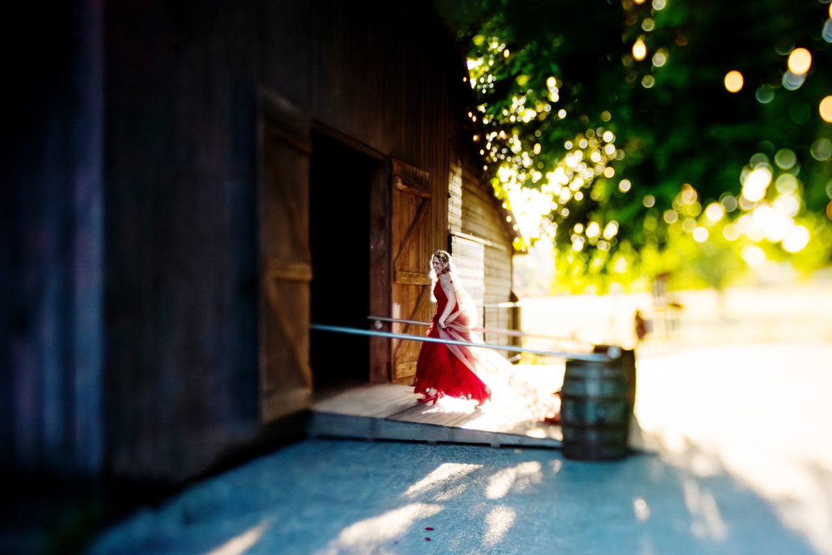 Red bridal gown at a farm wedding