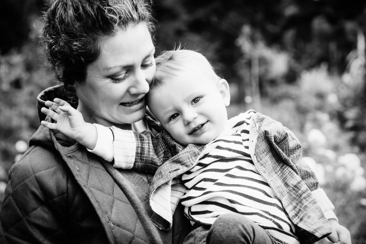 A mommy and me photo in black and white during a fall mini portrait session at Government House in British Columbia.