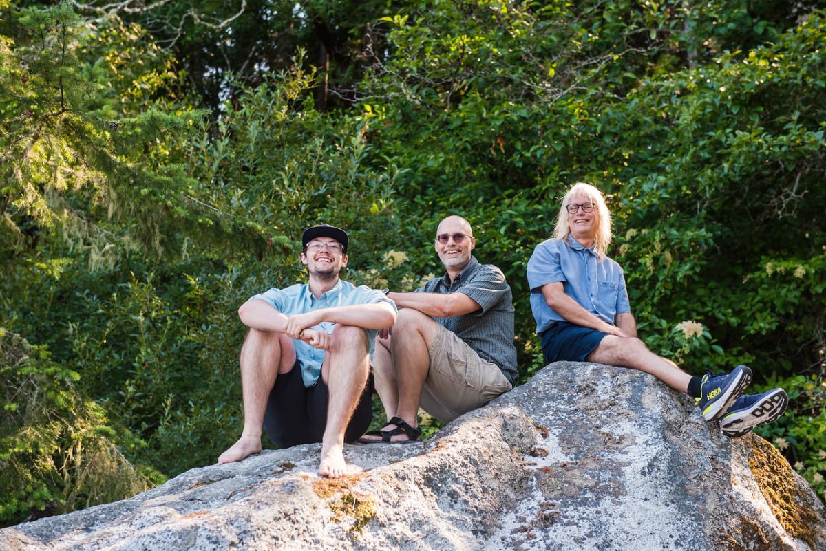 Three generations of family members in a family portrait