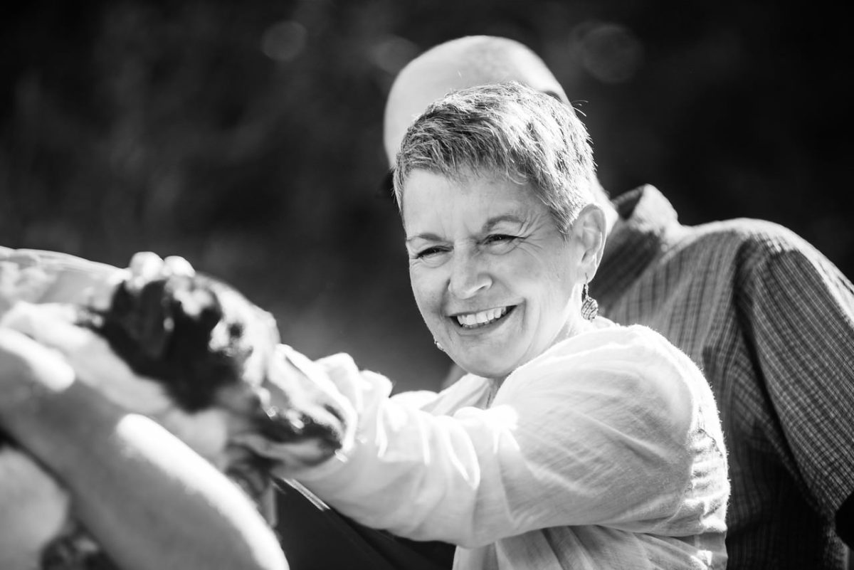 Candid and natural family portraits photographed in a documentary photojournalist style in black and white.