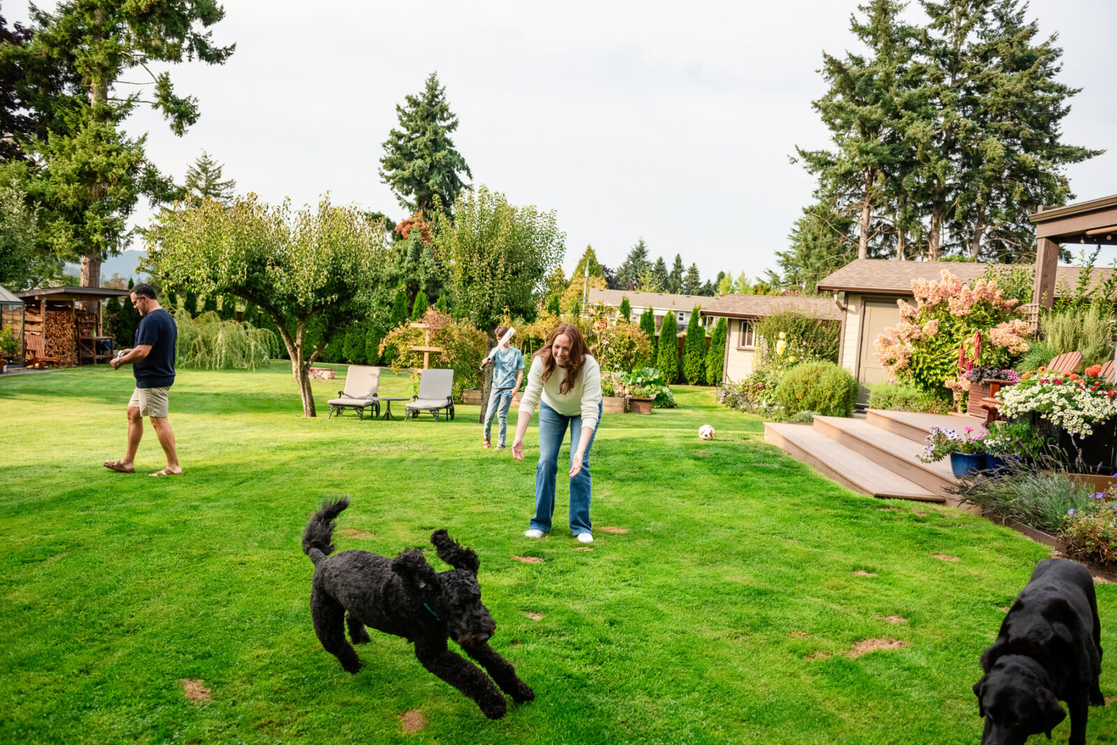 A candid photo of a mom chasing her dog in Victoria BC
