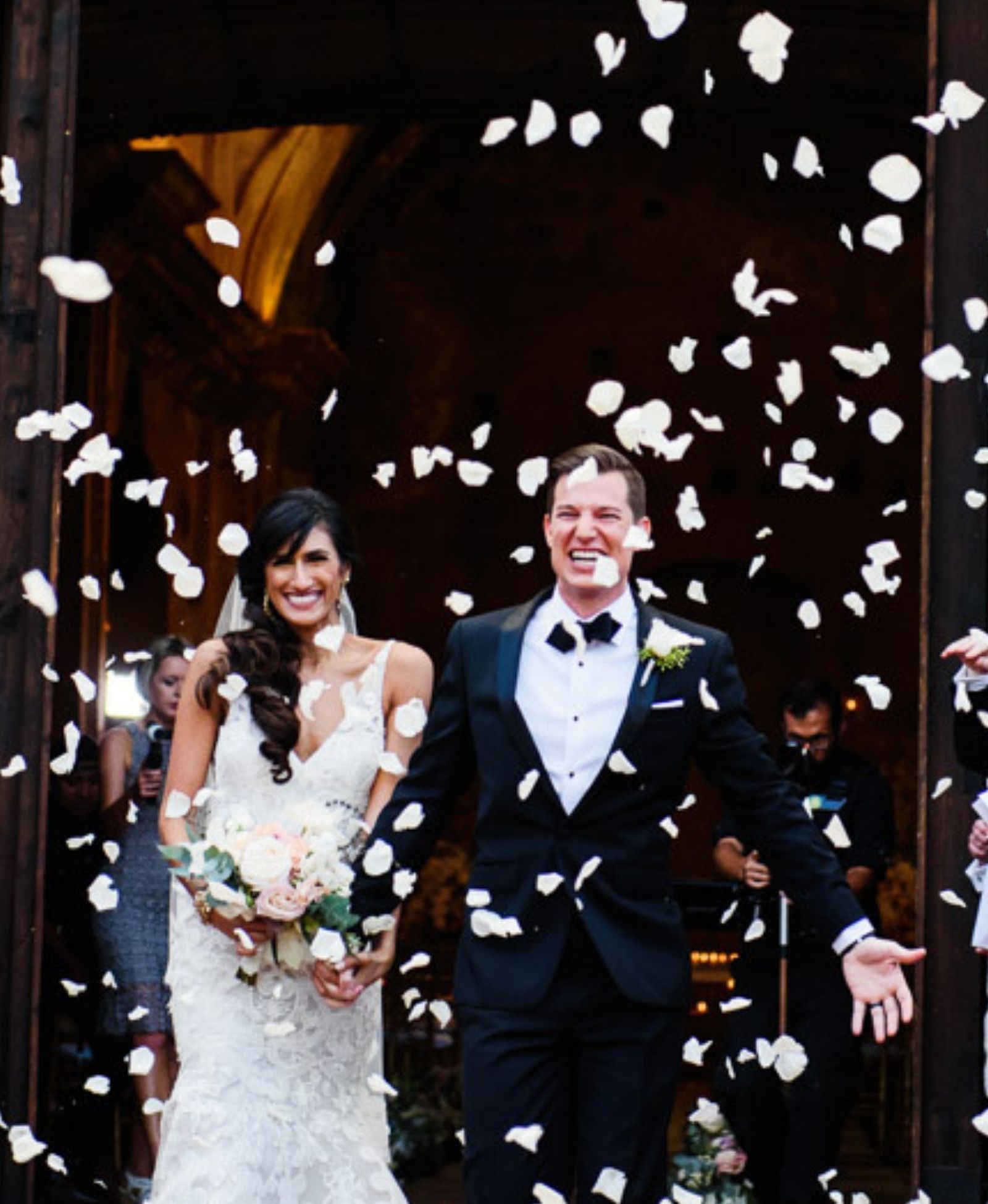 A couple leaves their church wedding in Victoria BC and confetti is being thrown at them