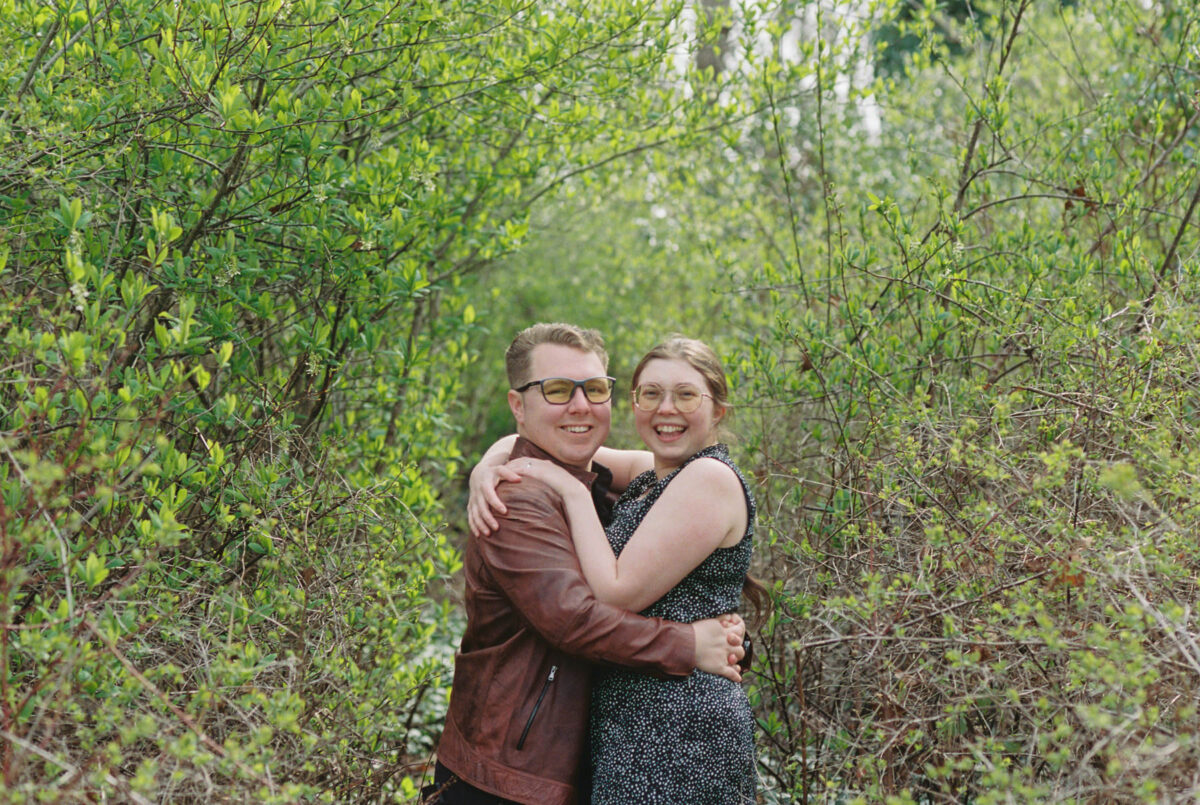 Beacon Hill Park Victoria BC at spring surrounded in newly budded greenery. This is an engagement portrait session of a couple taken with Kodak Portra 400 35mm film. 