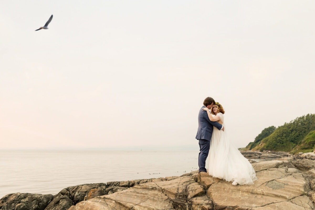 Victoria BC wedding portraits at the cliffs near the ocean at mile zero on Dallas Road