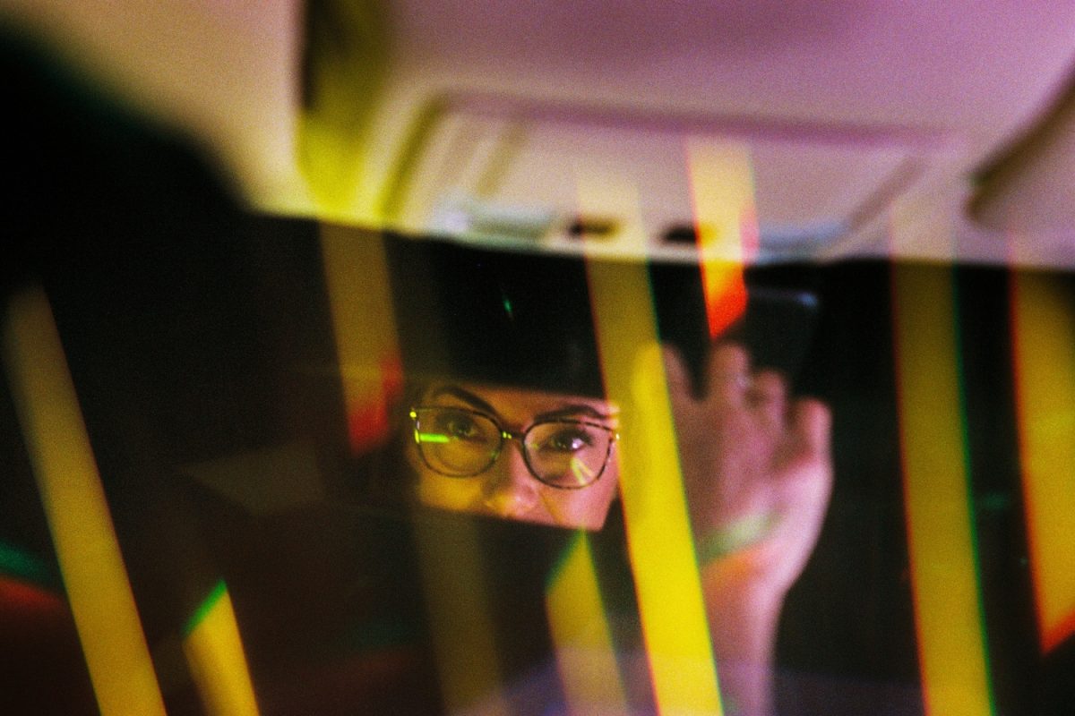 Our last stop was Britt's car, which was parked right under another bright street light. I loaded her car with my two wand lights and some video lights. Again, I had the 8-point star filter on the lens to create light streaks. The shot in the mirror is a double exposure taken with Ektacolor Pro 800.