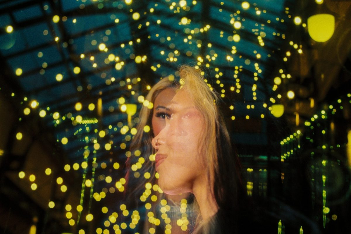 A double exposure portrait taken with Ektacolor Pro 800 35mm film of a fashion model in an alley in Victoria BC at night.