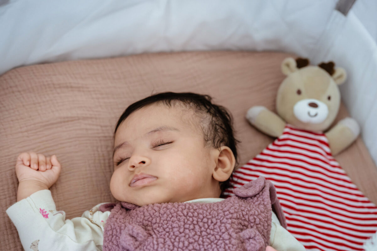 A sleeping baby in her crib at her home during a photo session in Victoria BC