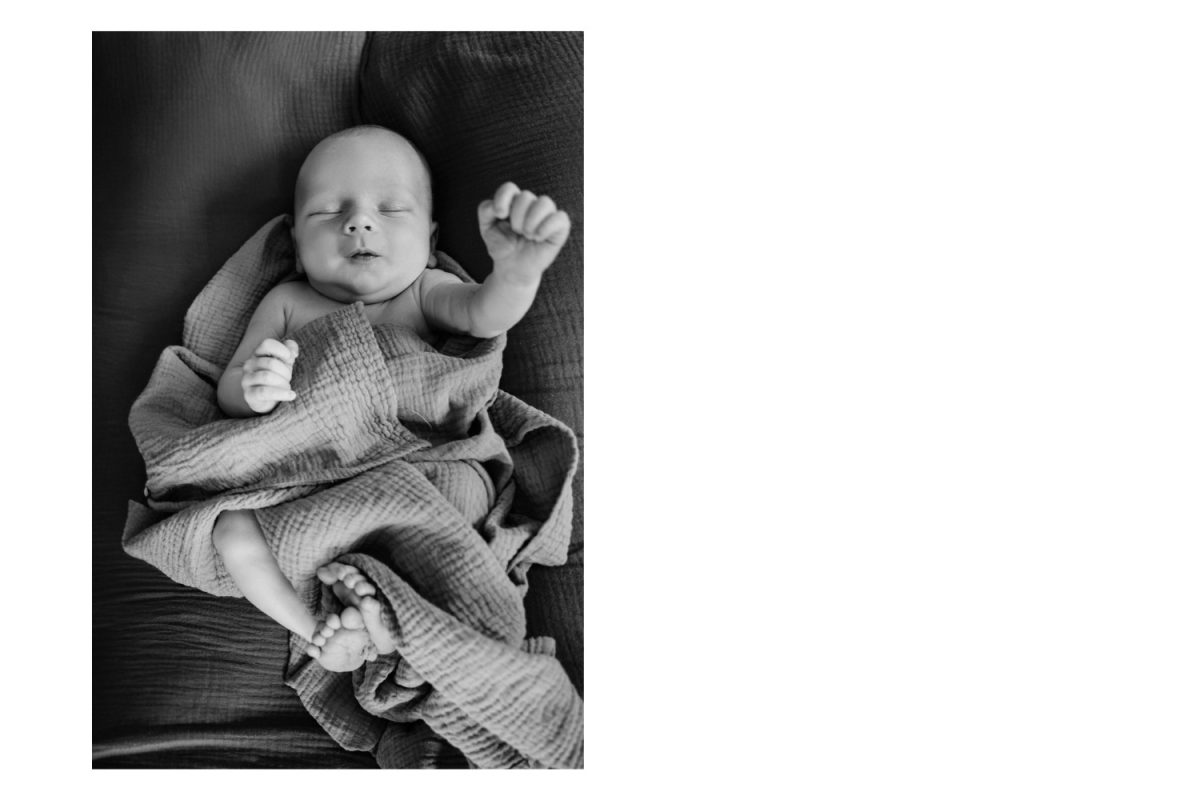 A funny baby portrait taken during an at-home newborn photo session in Victoria BC