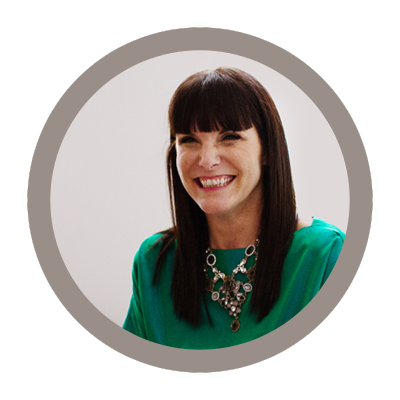 A photo of photographer Christina Craft wearing a green dress